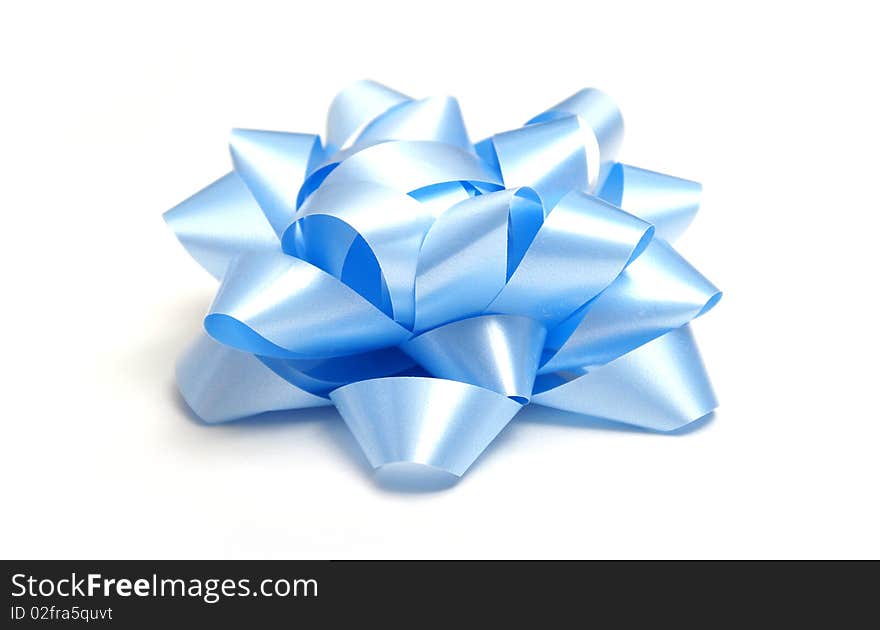 A macro shot of a nice blue bow isolated on white.