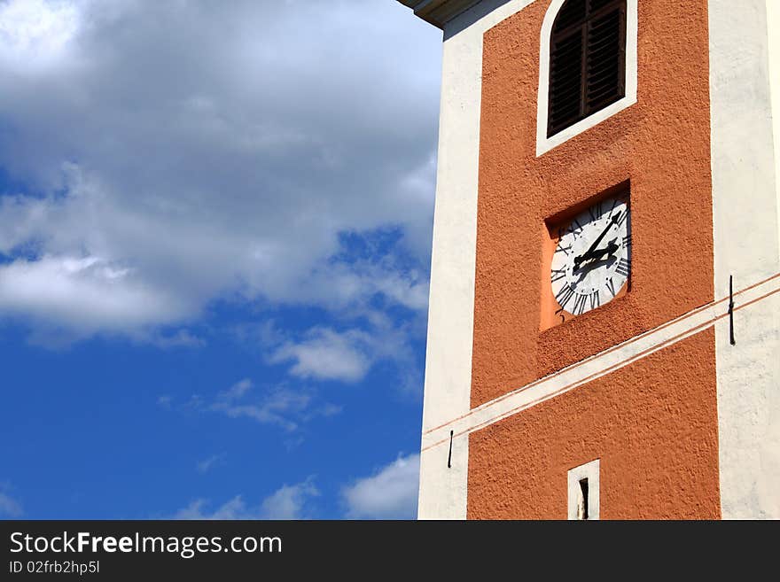 Old clock tower at 3.10 pm against partly cloudy blue sky. Old clock tower at 3.10 pm against partly cloudy blue sky