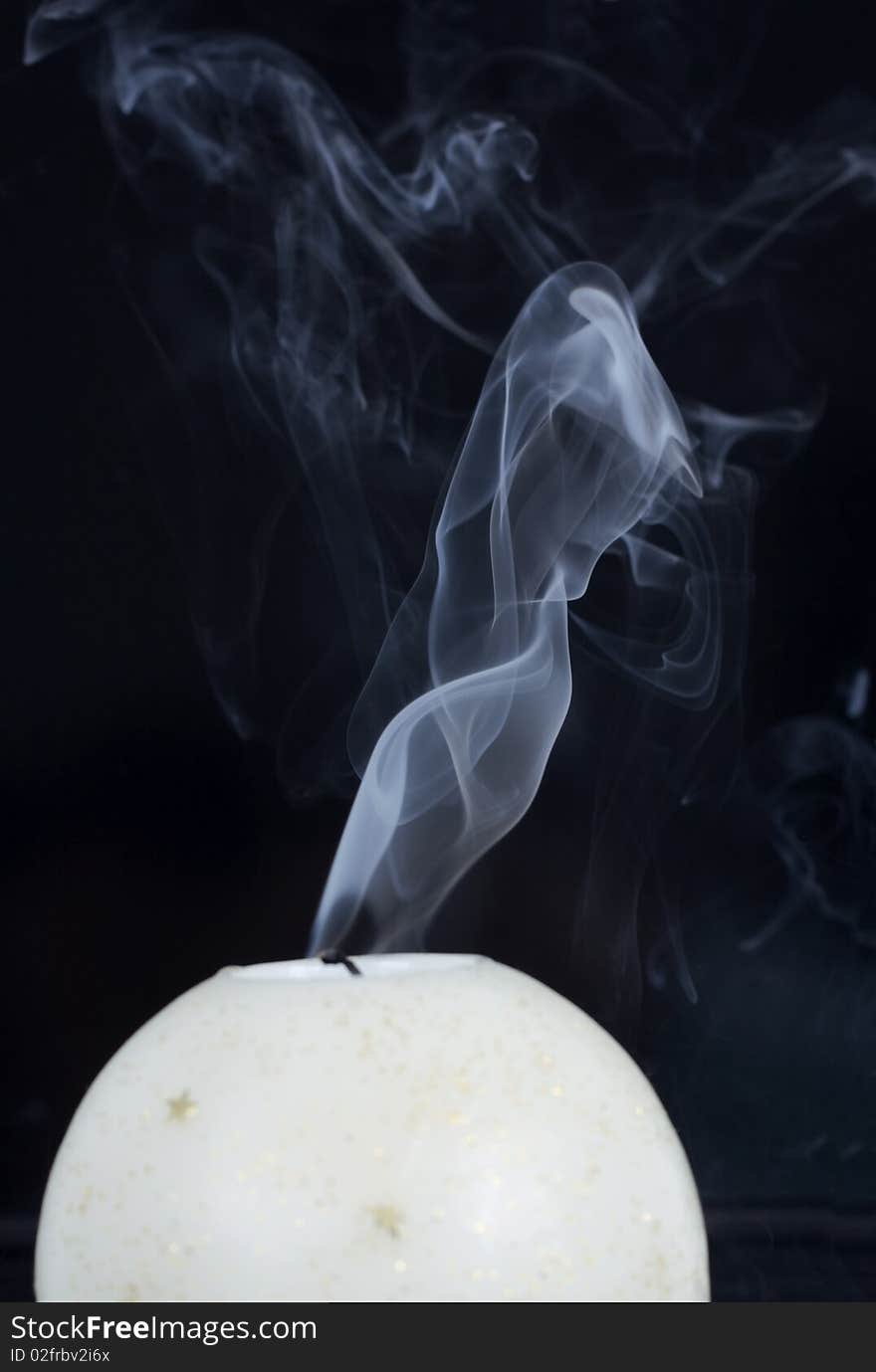 Candle isolated on black background