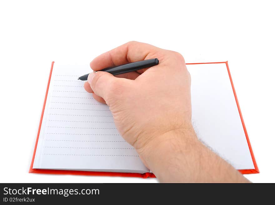 Open red note and pen with hand. Open red note and pen with hand