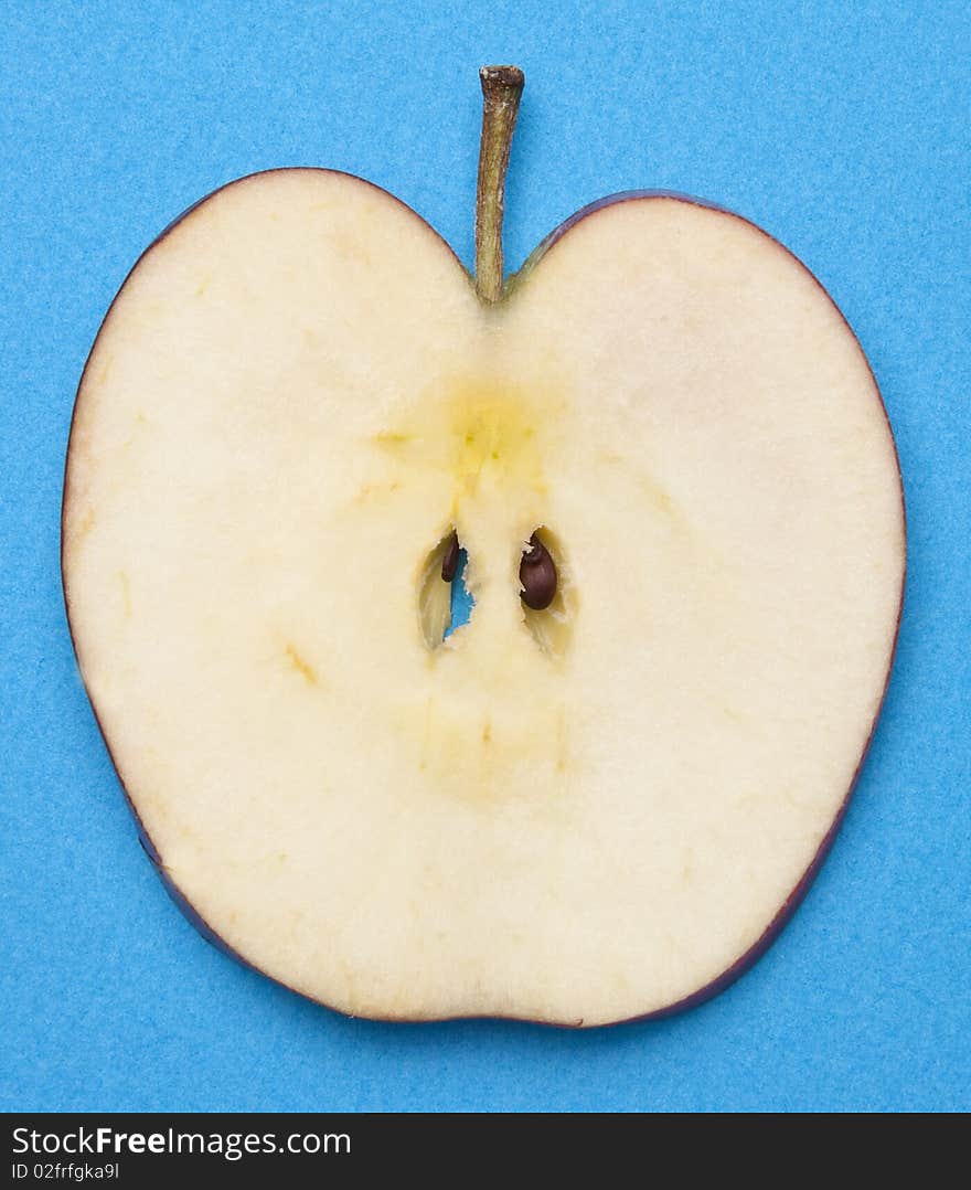 Apple Slice on a Vibrant Background with seeds.