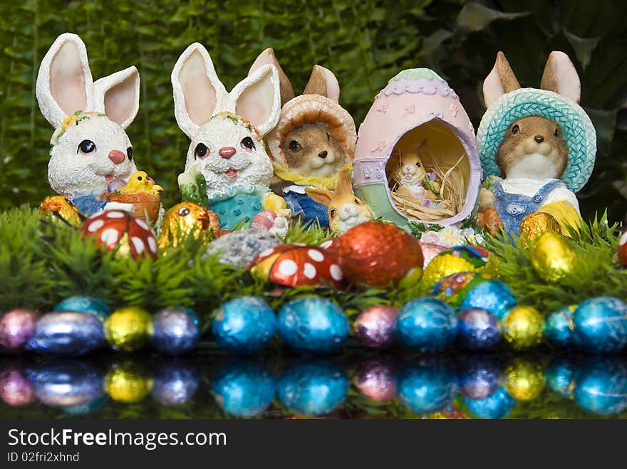 Easter bunnies and chocolate Easter eggs as decoration