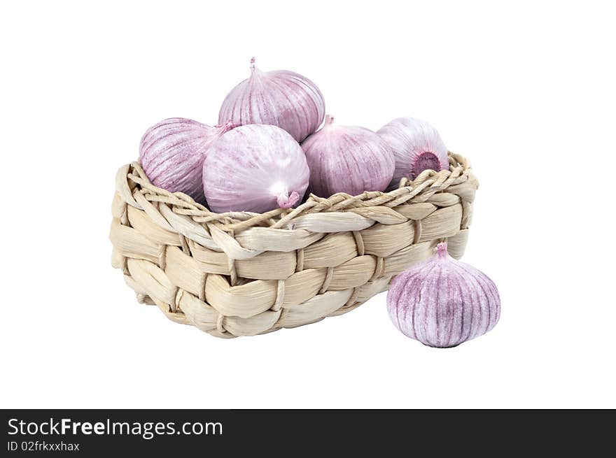 Several garlic in a wicker basket