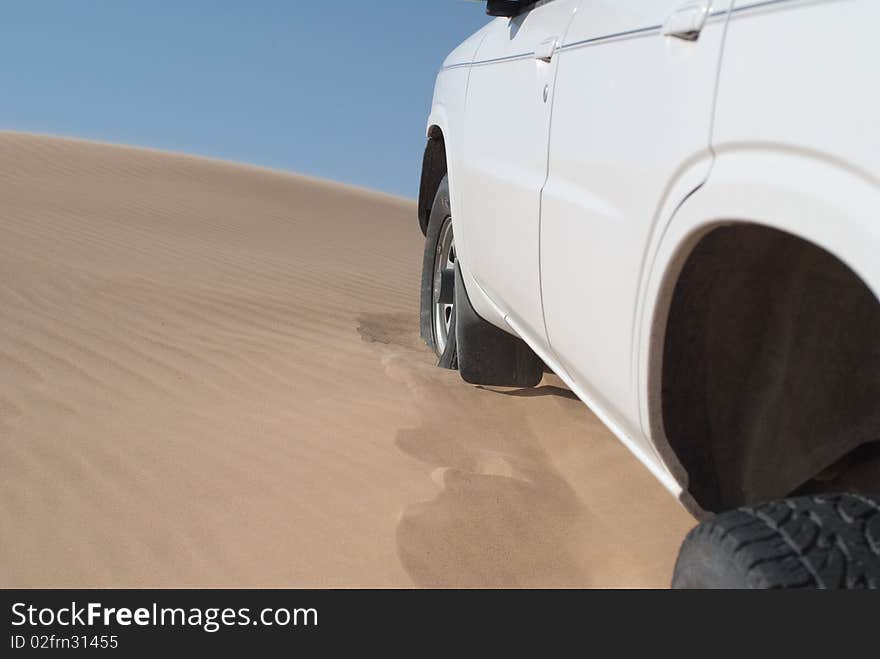 Car on soft sand dunes. Car on soft sand dunes