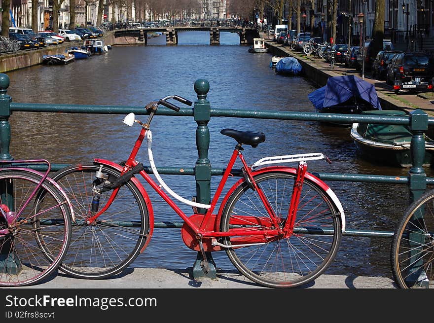 A bike on a bridge in Amsterdam. A bike on a bridge in Amsterdam