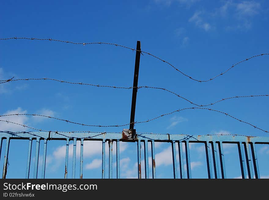 Barbed wire with a blue sky background