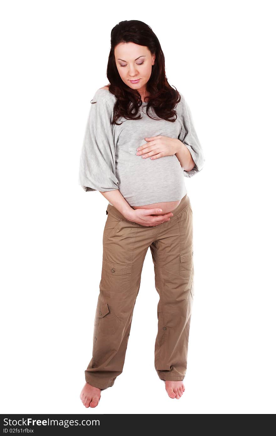 Pregnant woman touching her belly with hands