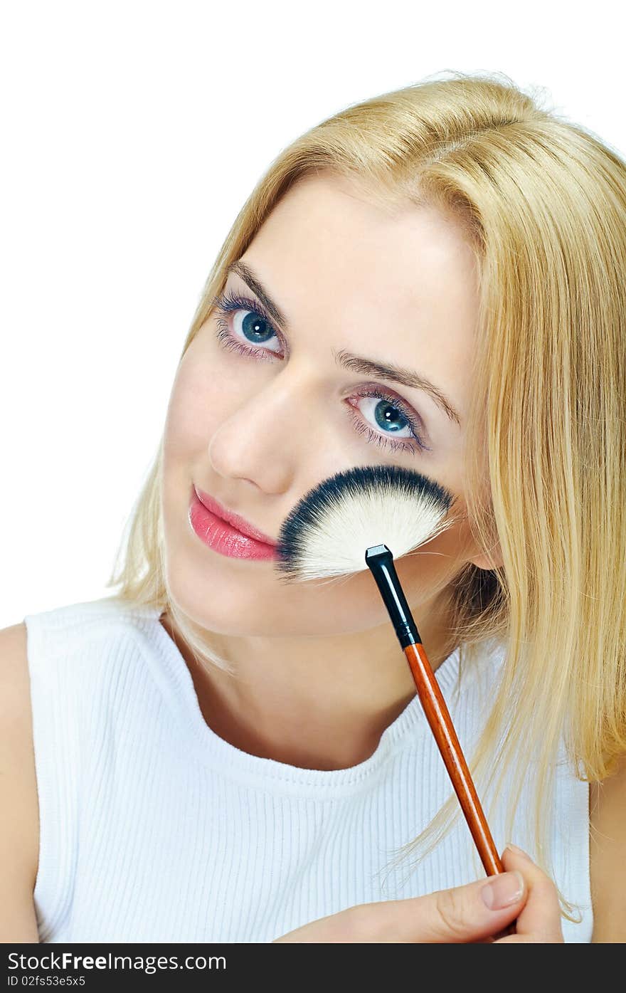 Beautiful girl with cosmetics brush on white. Beautiful girl with cosmetics brush on white