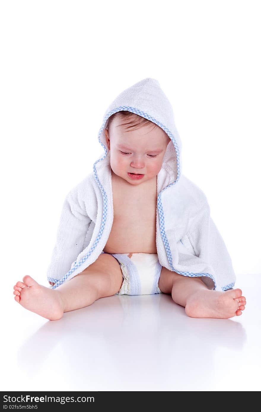 Little cute baby boyl in blue bathrobe