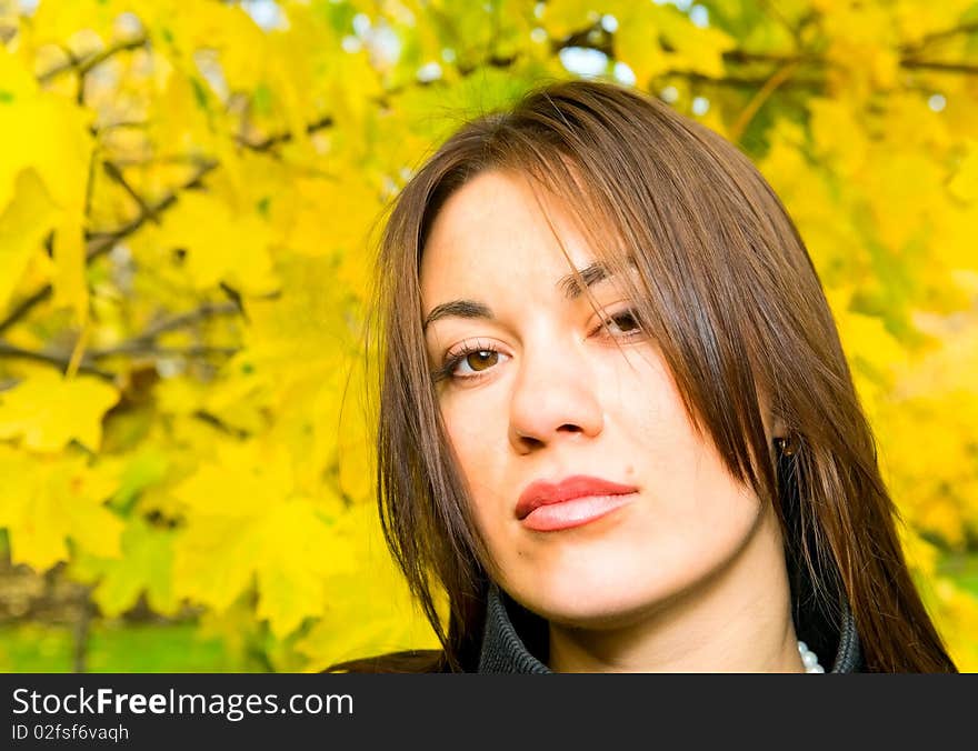 Girl and maple leaves