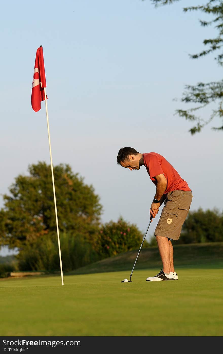 A golfer in full concentration. A golfer in full concentration