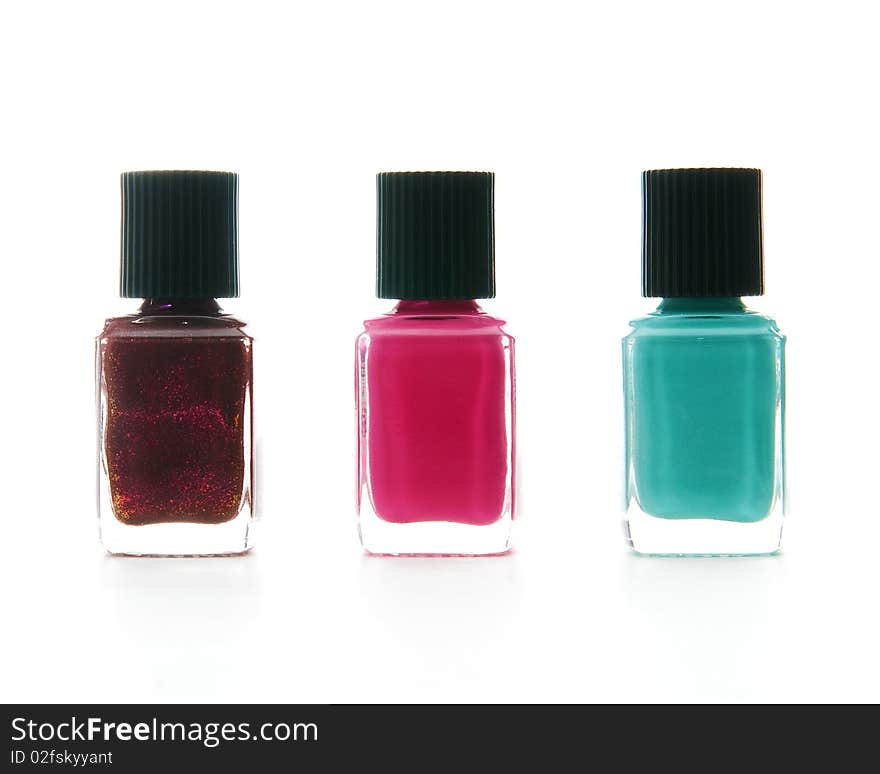 Nail polish bottles white isolated