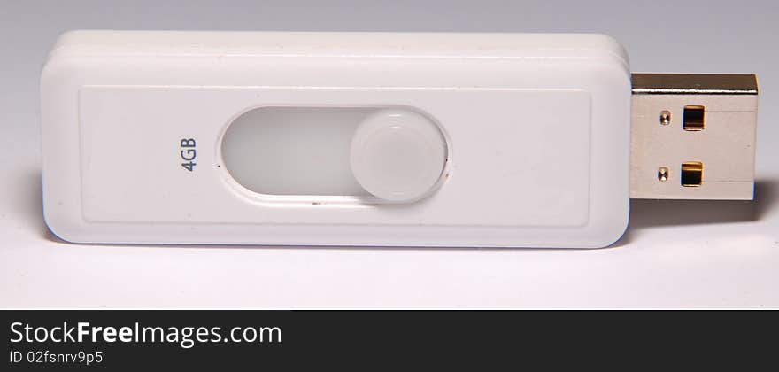 Photo of white flash drive. Photo of white flash drive