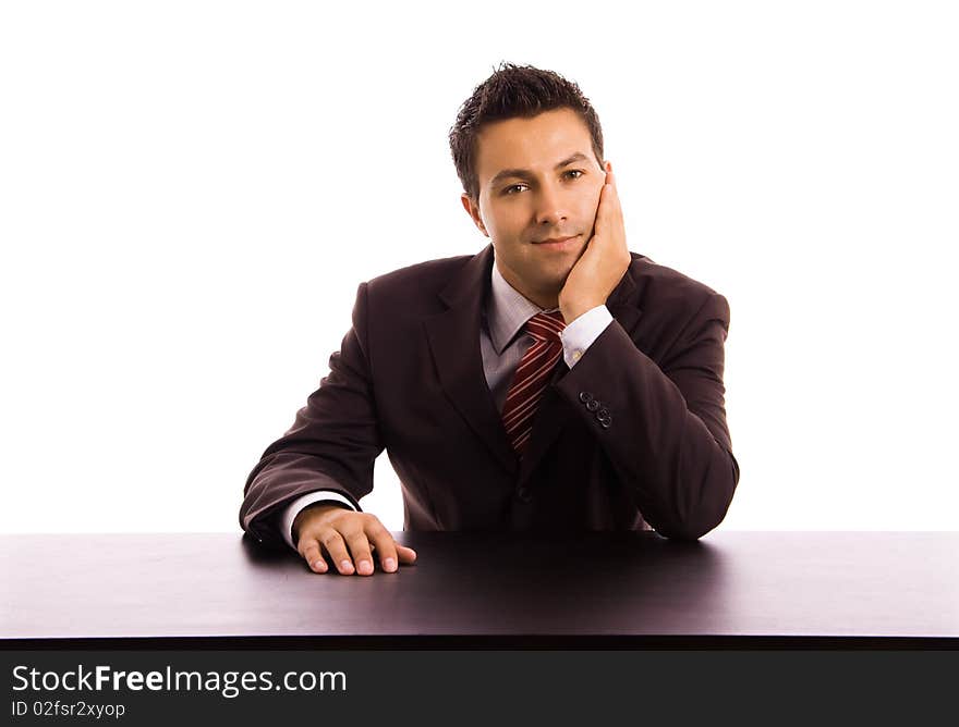 Young business man on a desk, isolated on white