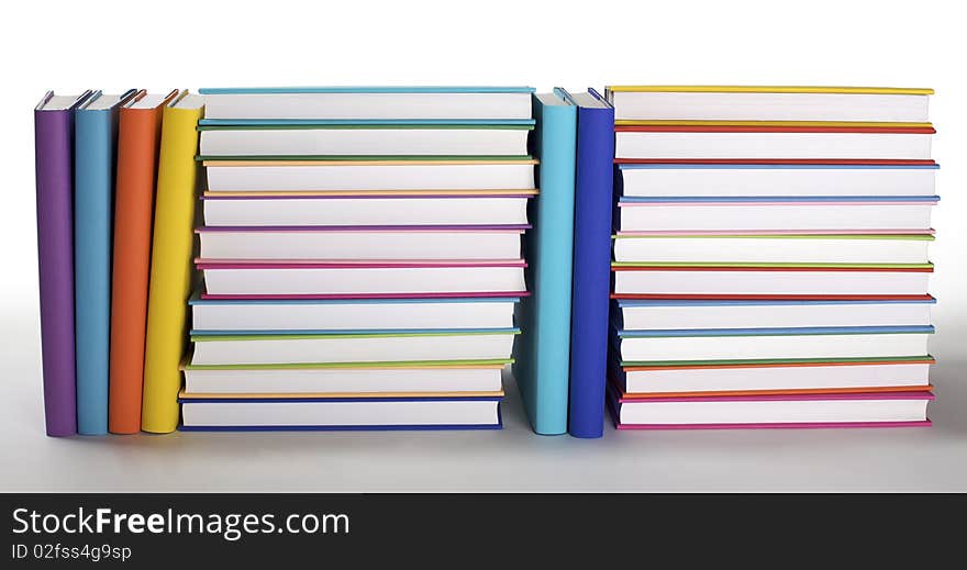 Arrangement of colorful books with blank covers on white background,  PHOTOGRAPH, NOT 3D RENDER. Arrangement of colorful books with blank covers on white background,  PHOTOGRAPH, NOT 3D RENDER.