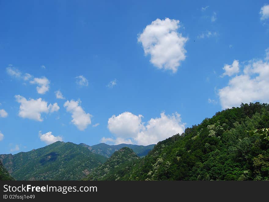 White clouds spread over Romanian mountains. White clouds spread over Romanian mountains.