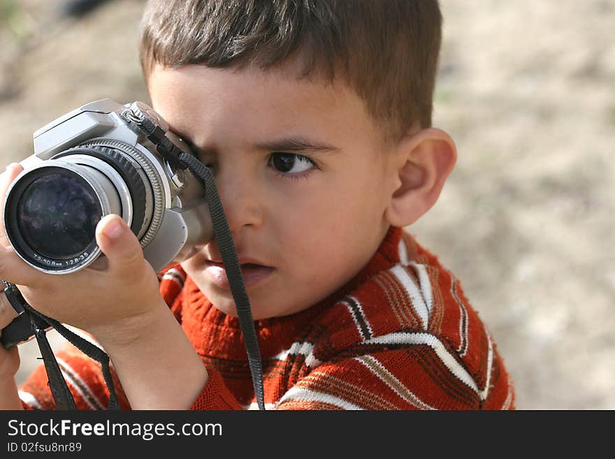 Cute little machine, view photos of a child. Cute little machine, view photos of a child