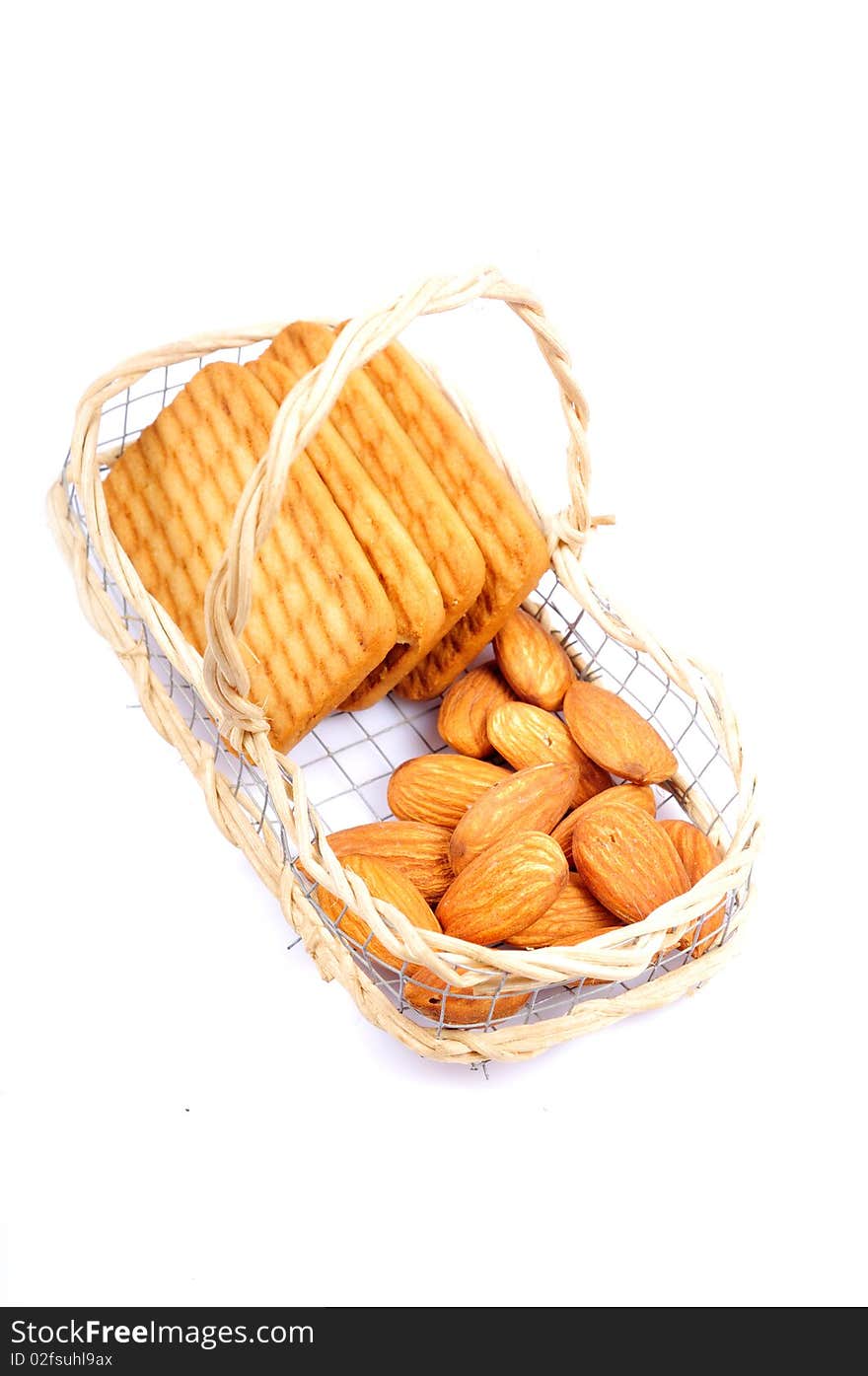 Almonds and biscuits isolated on white background.