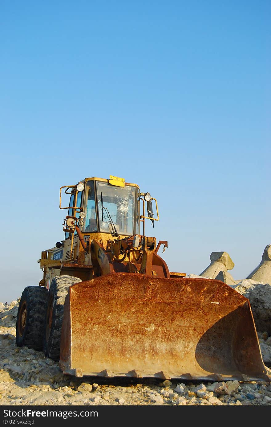 Construction front loader taking a break. Construction front loader taking a break