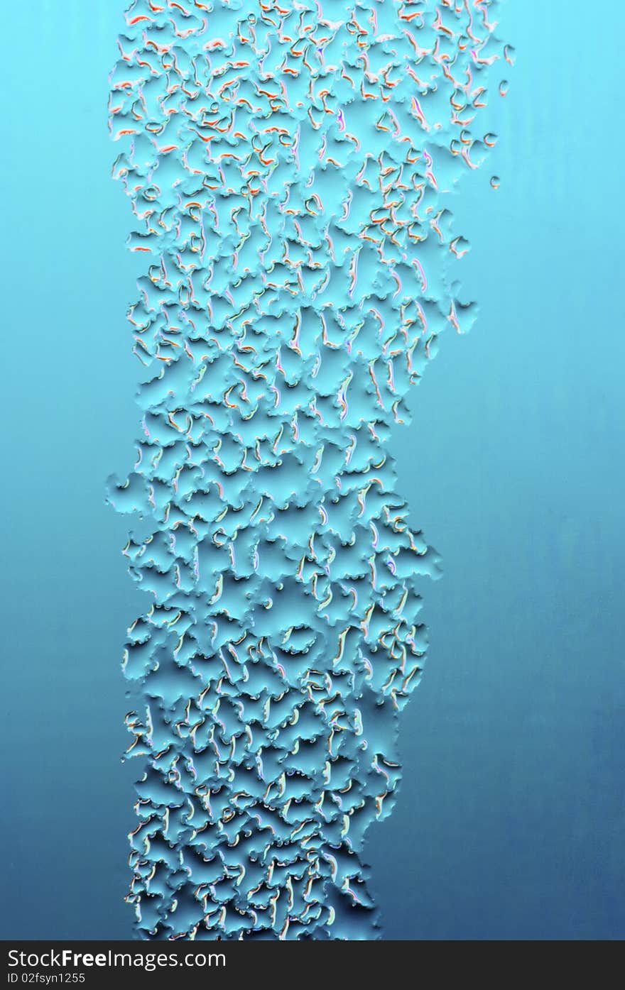 Abstract texture formed by water droplets on a blue background