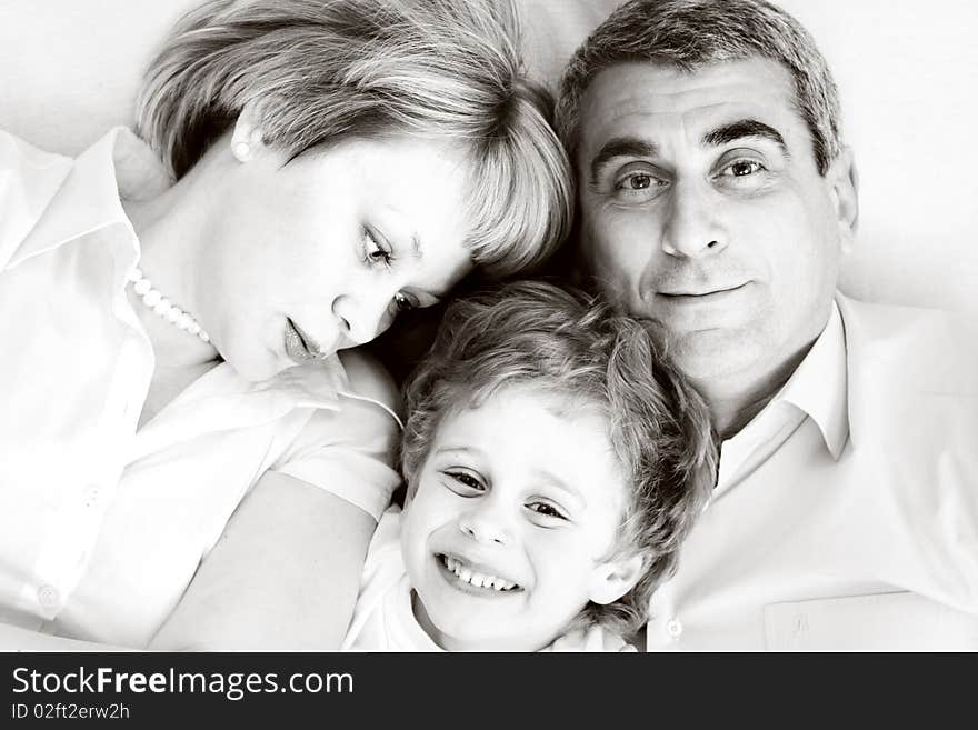 Happy family home: father, mother and - black and white photo. Happy family home: father, mother and - black and white photo