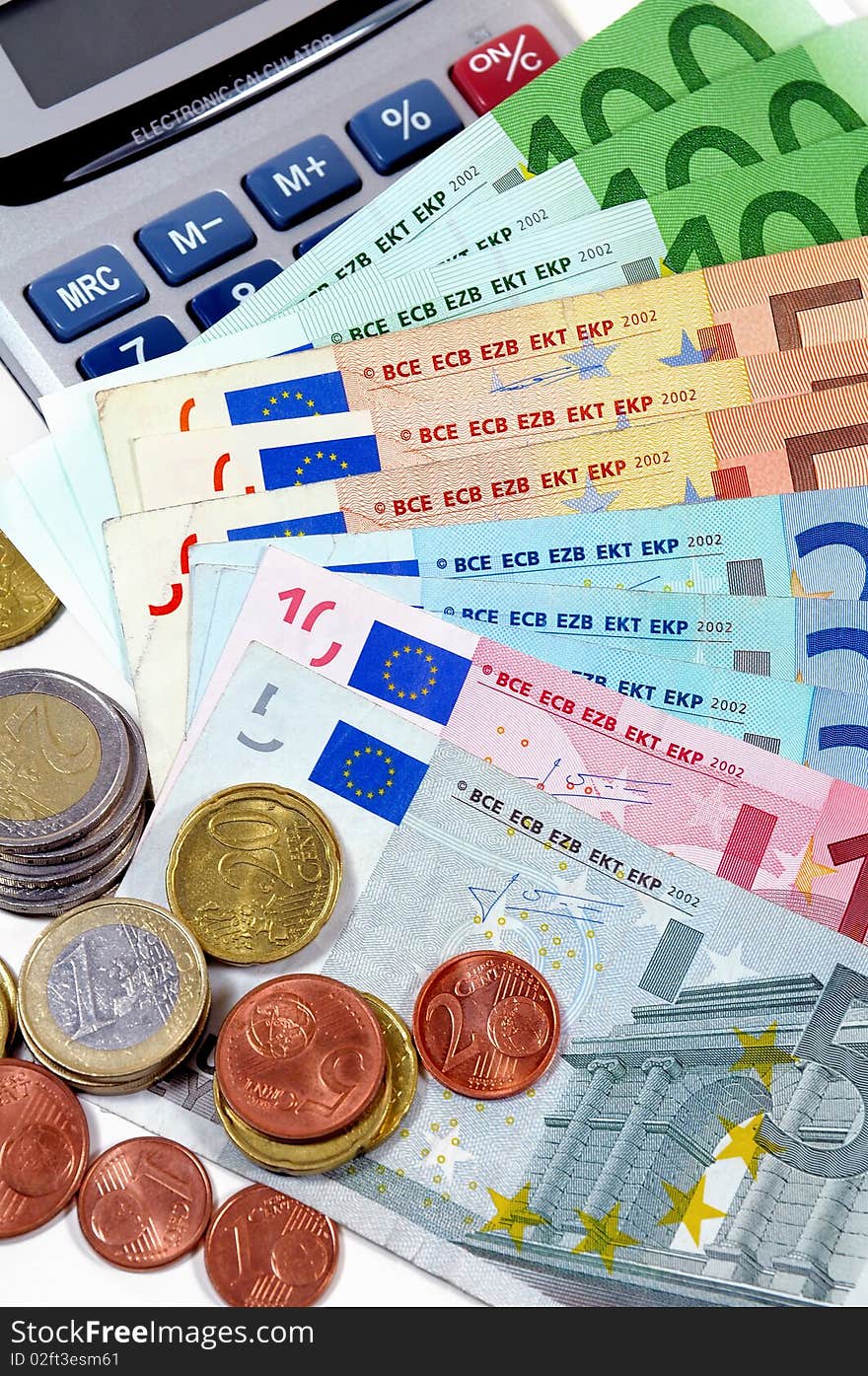 Euro banknotes with coins and calculator. Euro banknotes with coins and calculator