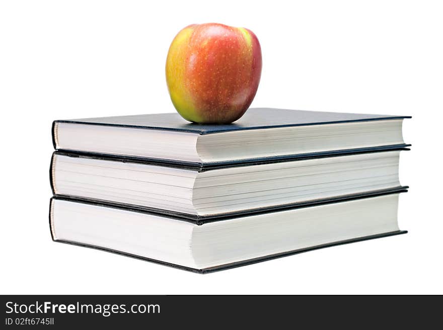 Red-yellow apple and open book isolated on a white background. Red-yellow apple and open book isolated on a white background.