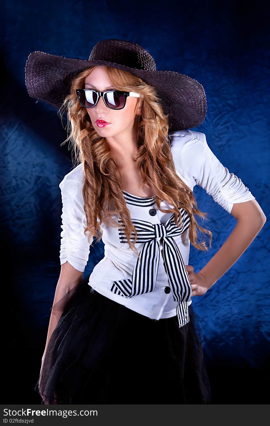 Photo-session of the young beautiful woman with black hat. Photo-session of the young beautiful woman with black hat