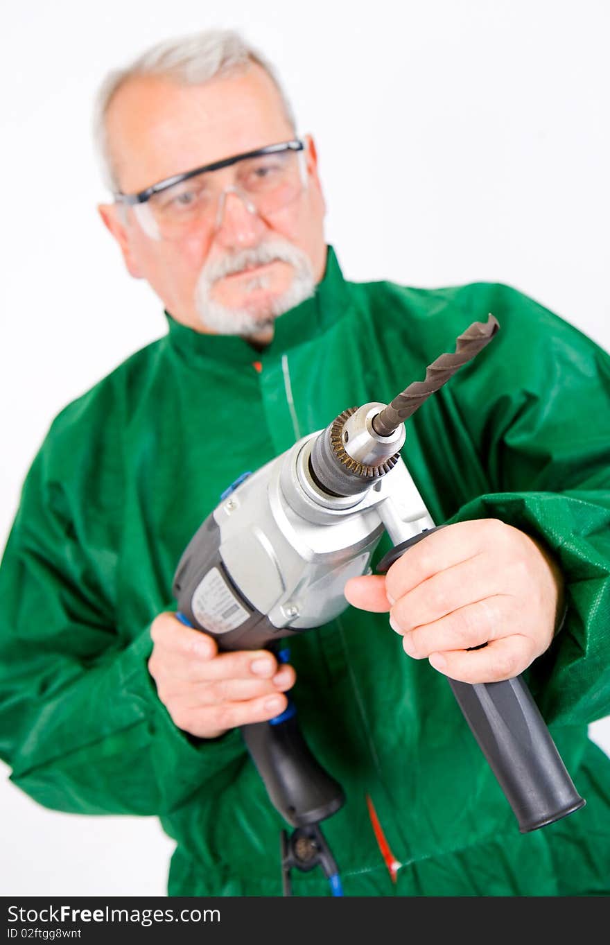 Construction worker holding the electric hand drill. Construction worker holding the electric hand drill