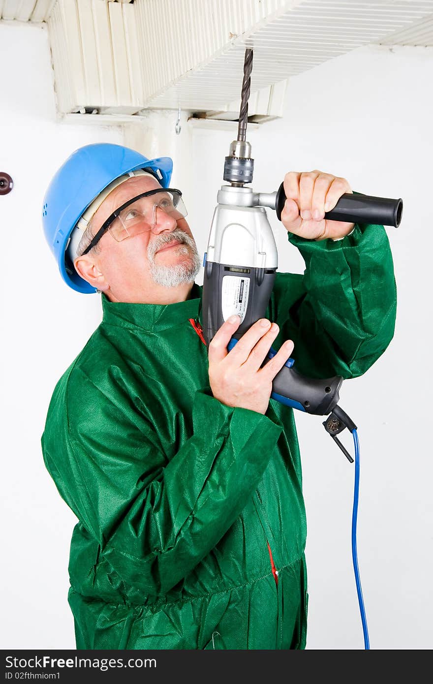 Construction worker holding the electric hand drill. Construction worker holding the electric hand drill