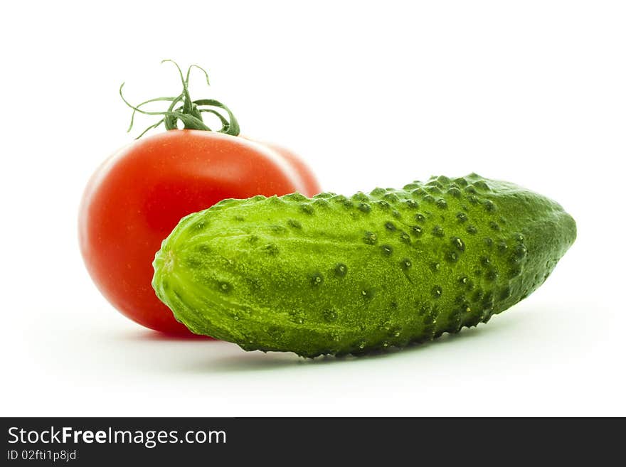 Cucumber and tomato isolated on white