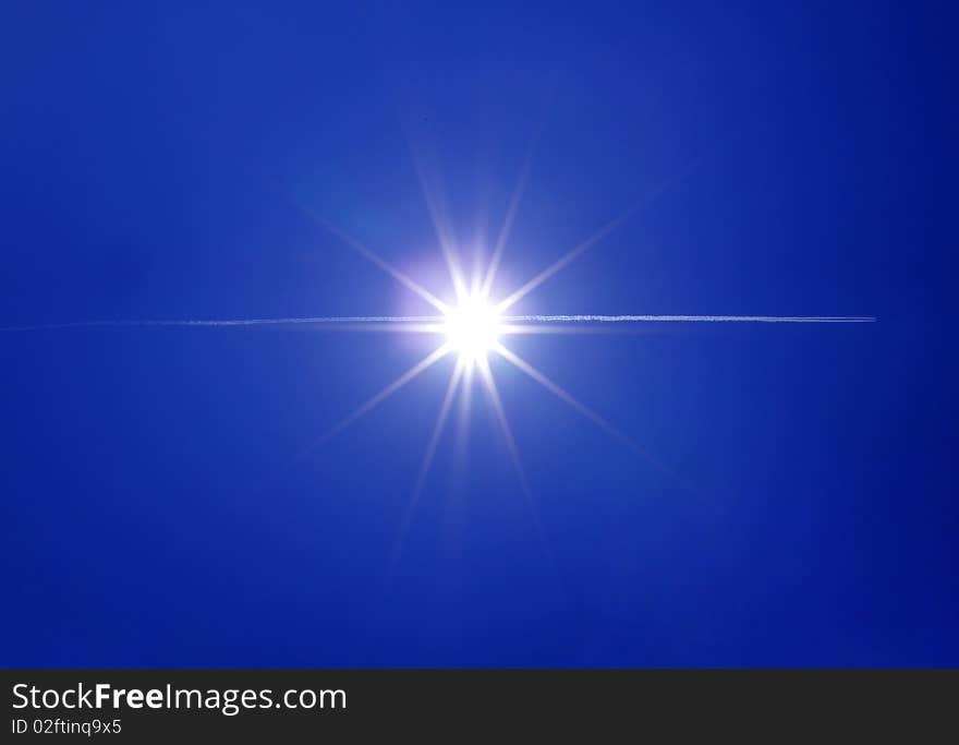 Airplane flying through the sun. Airplane flying through the sun