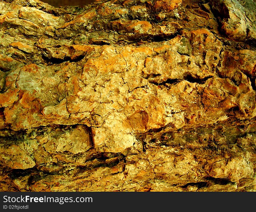 A rough textured Rock surface background. A rough textured Rock surface background