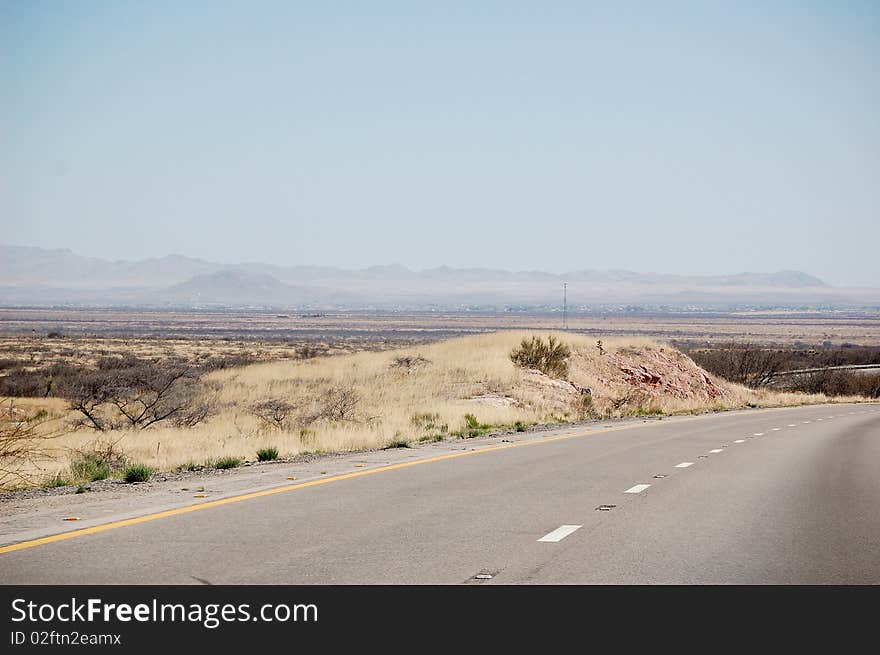 Desert Road with mountains in the background