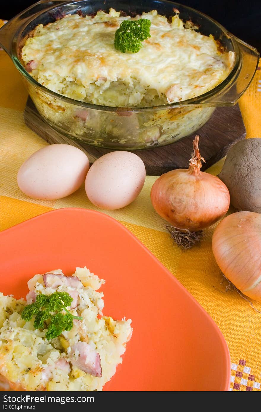 Baked potatoes with cheese and onions