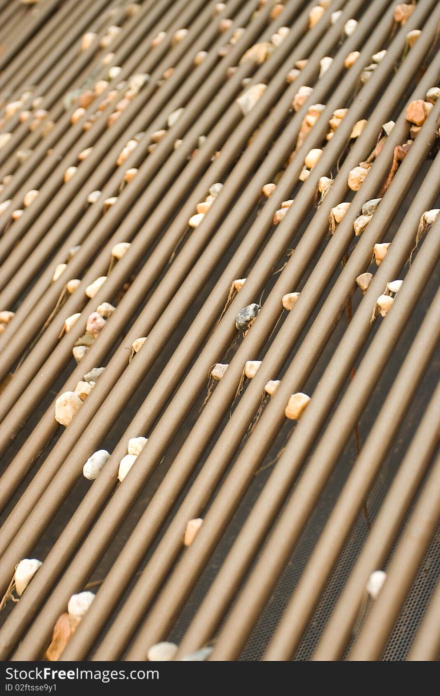 Stones stick on a big colander in a construction ground. Stones stick on a big colander in a construction ground.