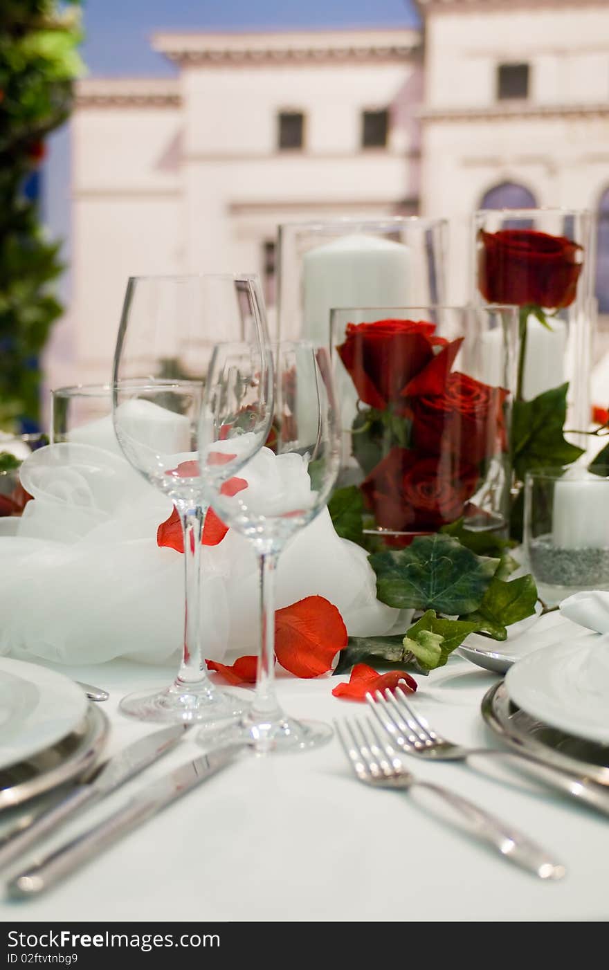 Covered banquet with red roses decoration. Covered banquet with red roses decoration