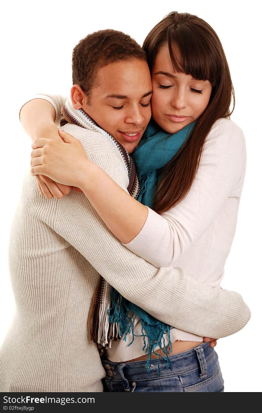 Young couple cuddling isolated on white. Young couple cuddling isolated on white