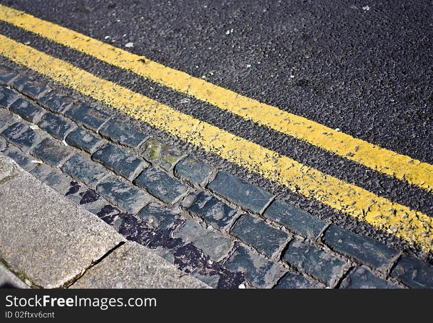 double yellow lines on a road signalling no parking