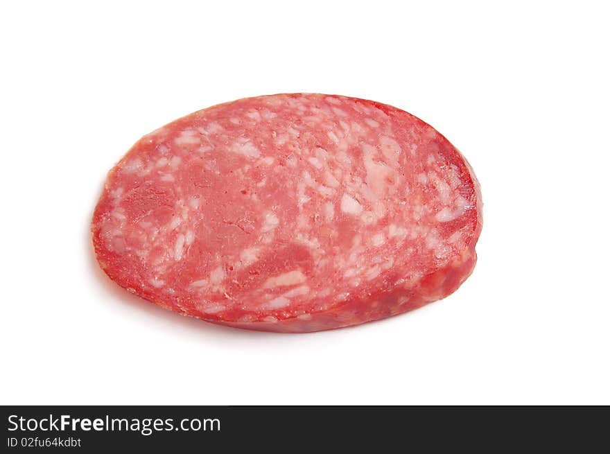 Piece of sausage on the white