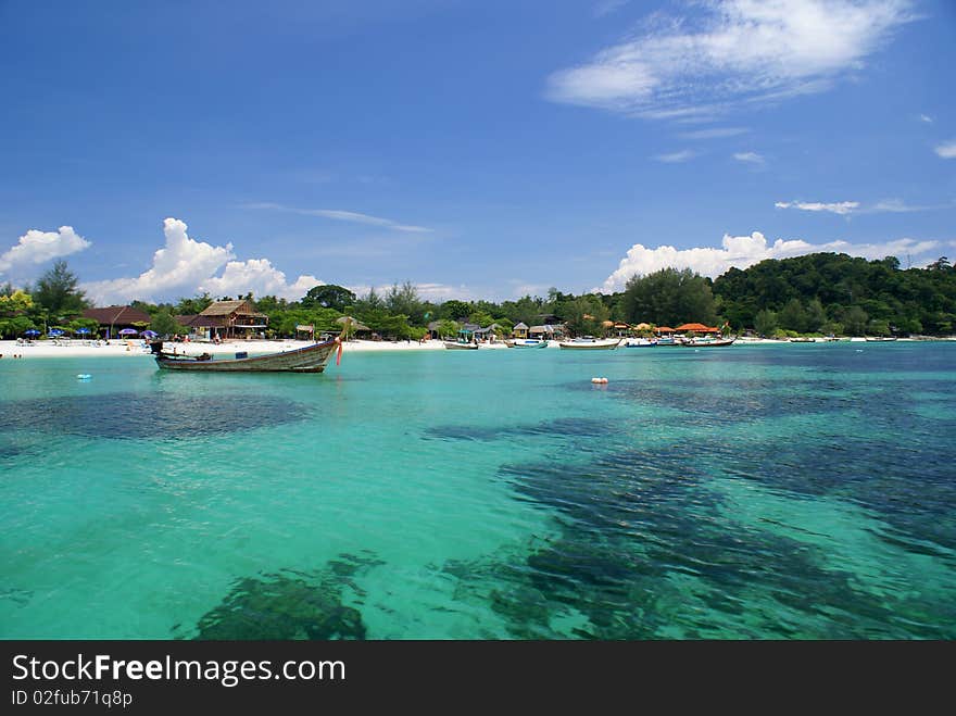 This is a picture of the boat on the beach in thailand. This is a picture of the boat on the beach in thailand