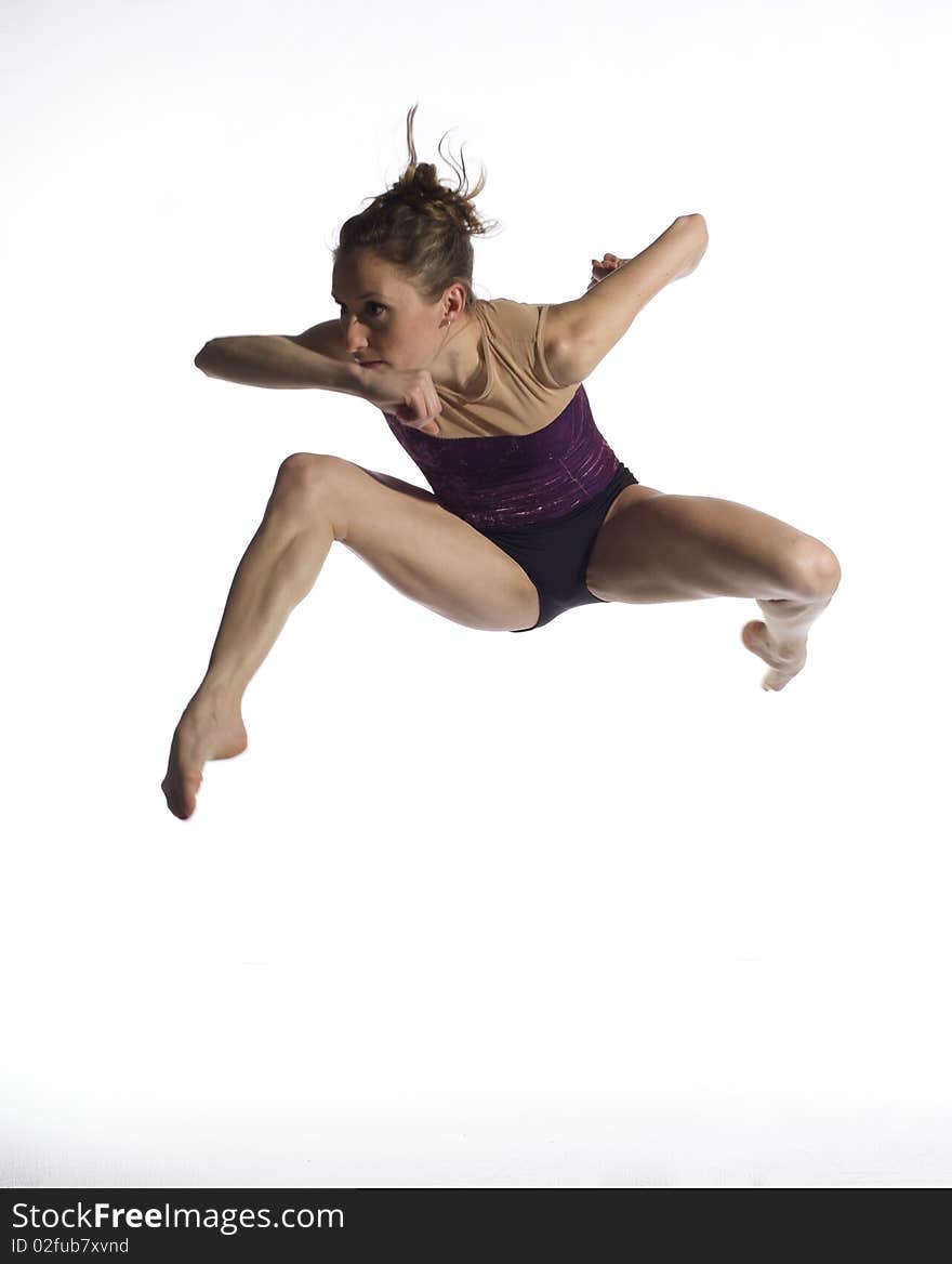 Young beautiful Ballerina on white background