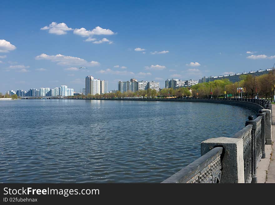 Quay of moscow river with homes on horizon. Quay of moscow river with homes on horizon