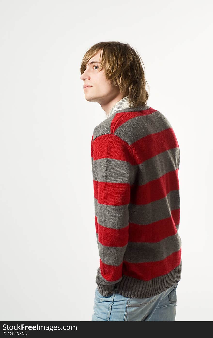 Portrait of young man on light grey background