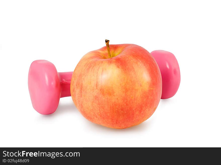 One dumbbell and red apple on a white background. One dumbbell and red apple on a white background