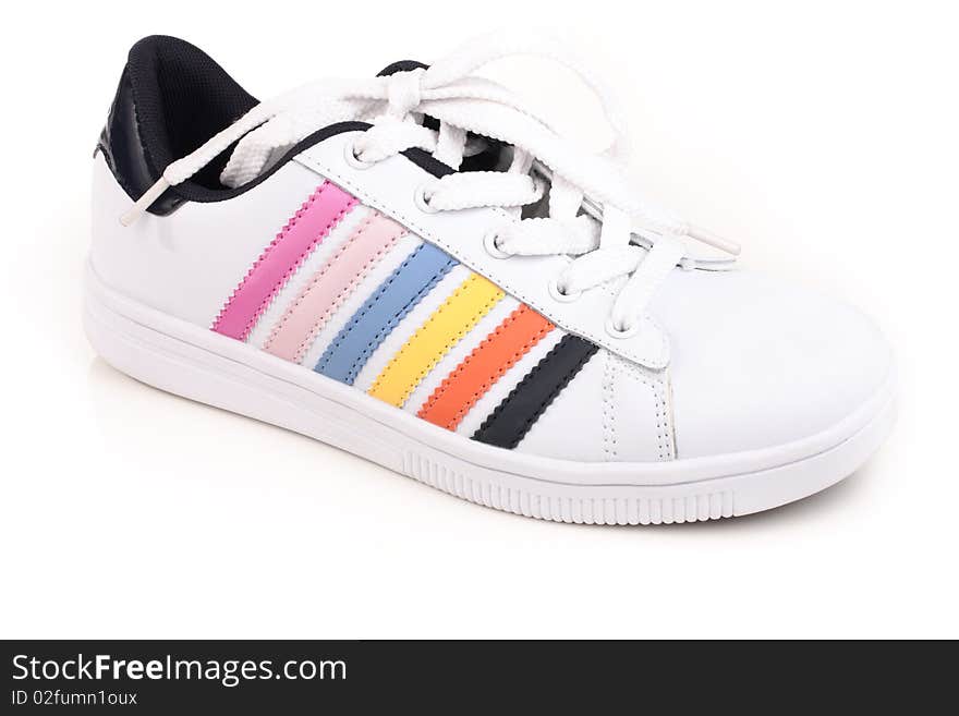 Athletic shoes with colorful stripes on a light background