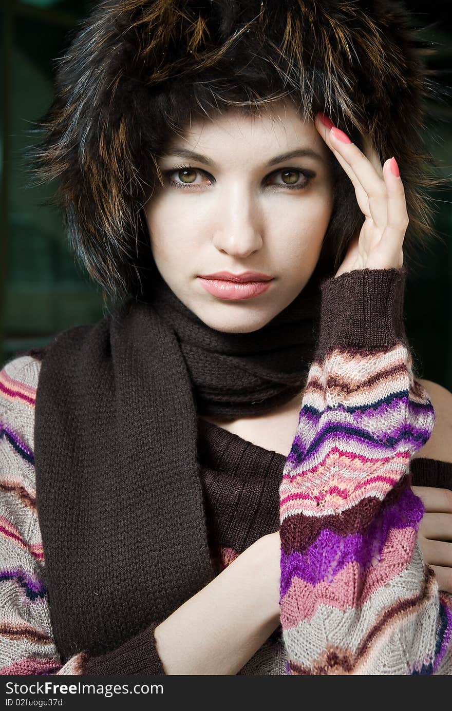 Winter portrait of young woman in fur hat