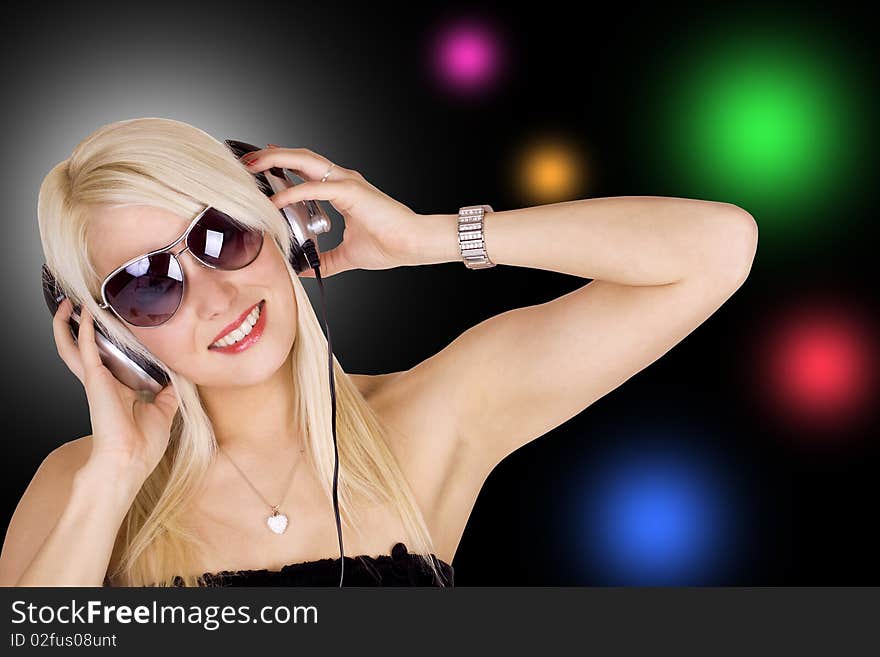 Beautiful blond girl wearing headphones. Beautiful blond girl wearing headphones