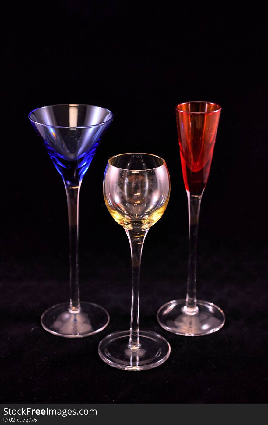 3 drink glasses in primary colors, full view. 3 drink glasses in primary colors, full view