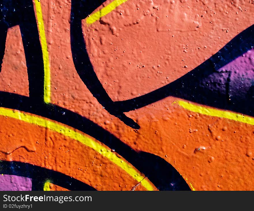 Segment of graffiti on an air duct on the side of a derelict building